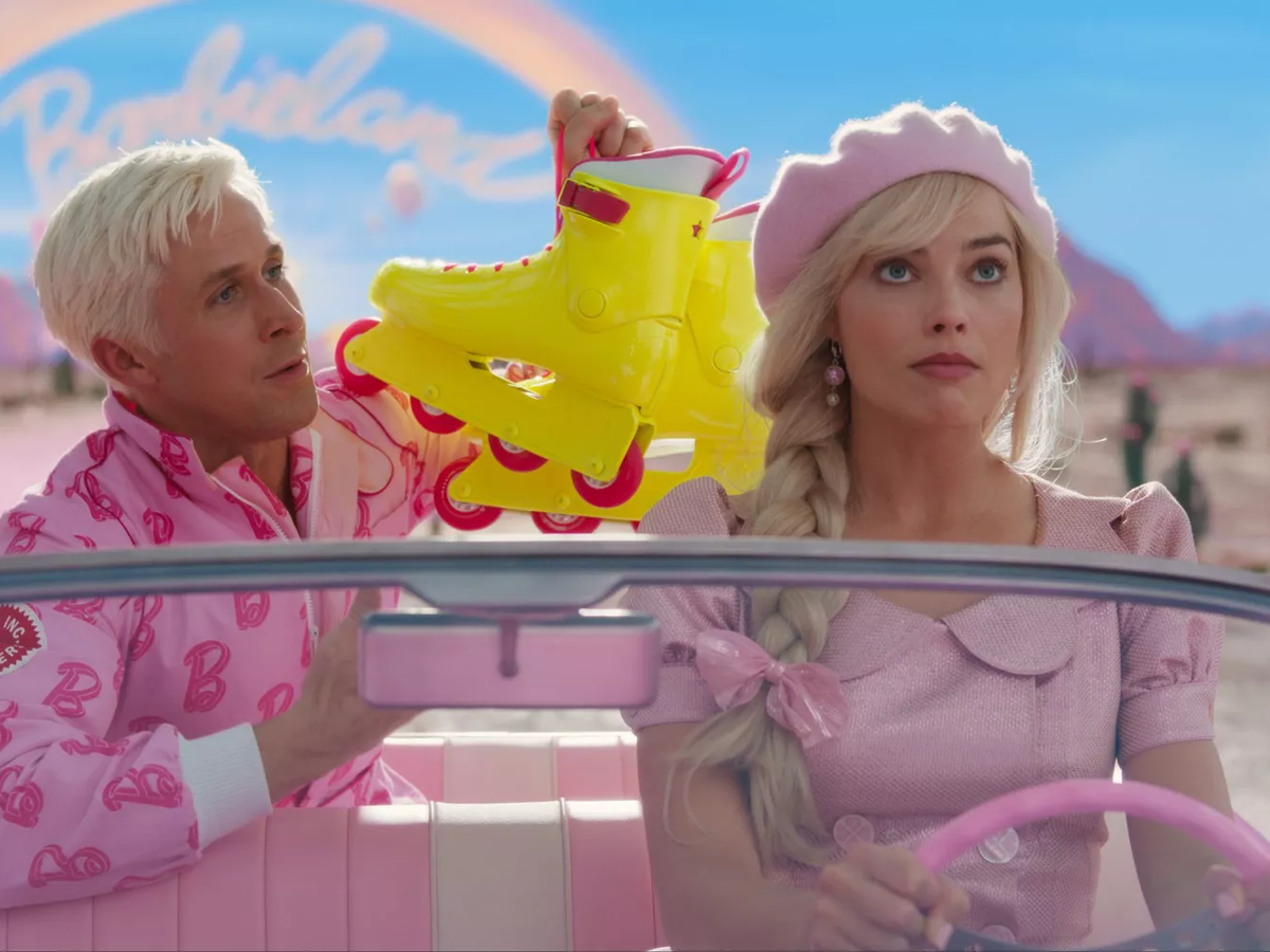 Ken surprises Barbie on her journey to the real world (photo via Warner Bros.)