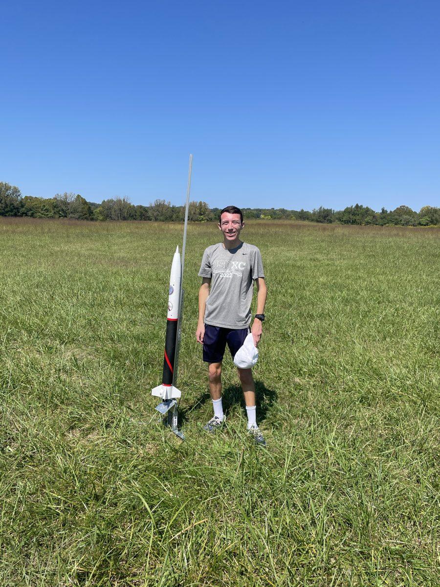 Brackett poses next to his rocket for Project 767 (photo provided).