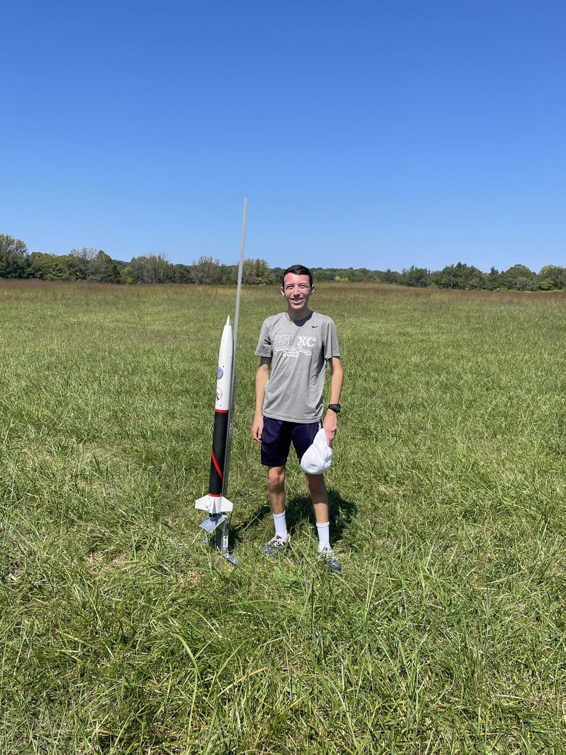 Brackett poses next to his rocket for Project 767 (photo provided).