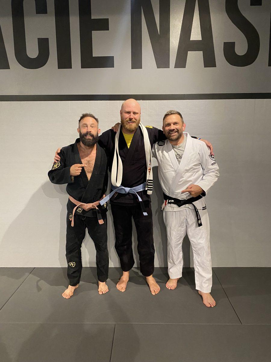 Hedman (center) poses with his coach, John Keefe (left) and Professor Shawn Williams (right) upon earning his blue belt in Jiu Jitsu. (photo provided)