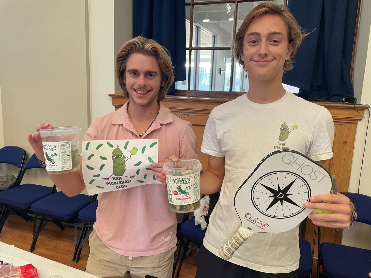 Ozgener and Fox pose at their table at the Club/Org Fair on September 21