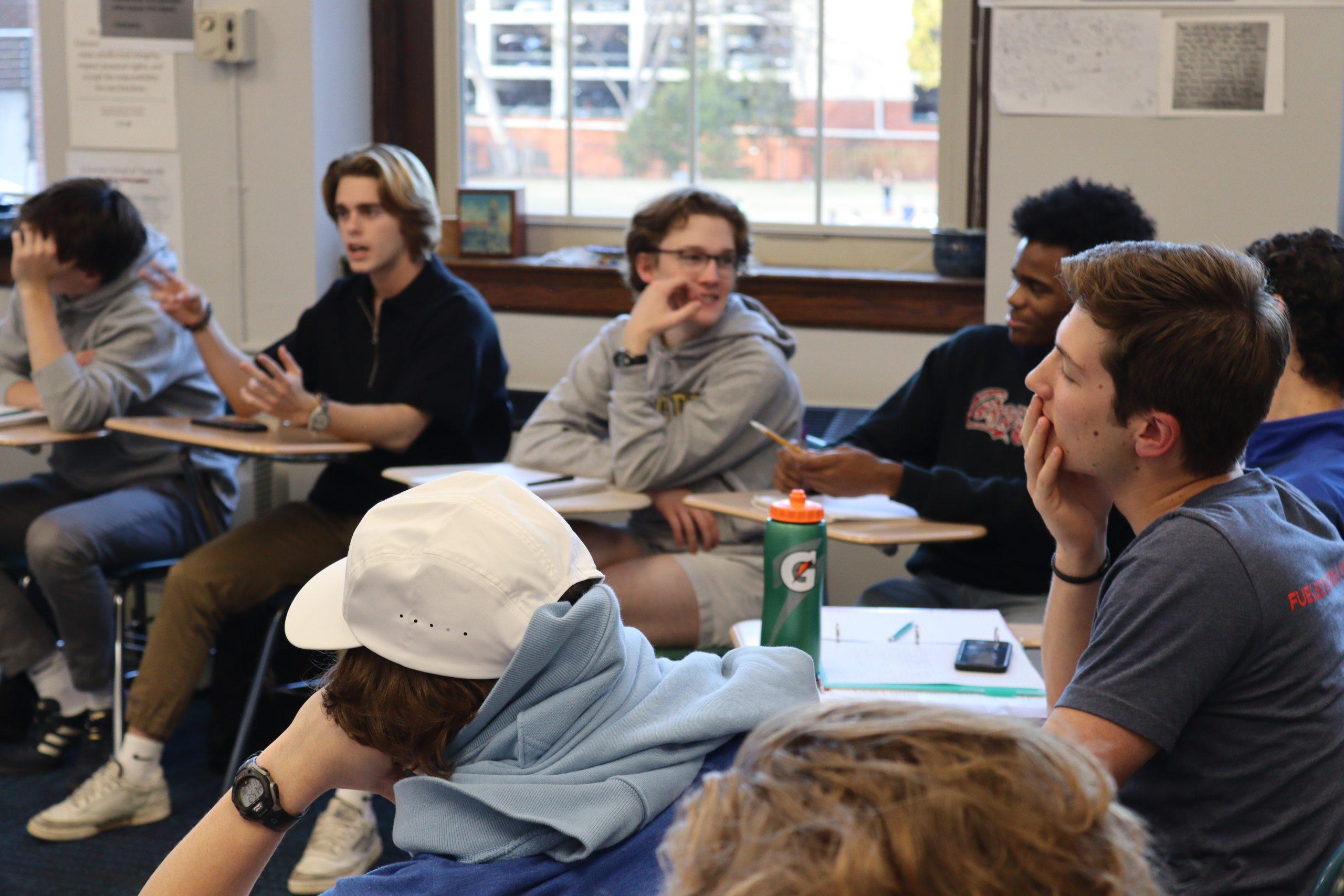 Senior Benjamin Kampine (right) listens in on a discussion surrounding the legality of hate speech in America. (via the Peabody Press)