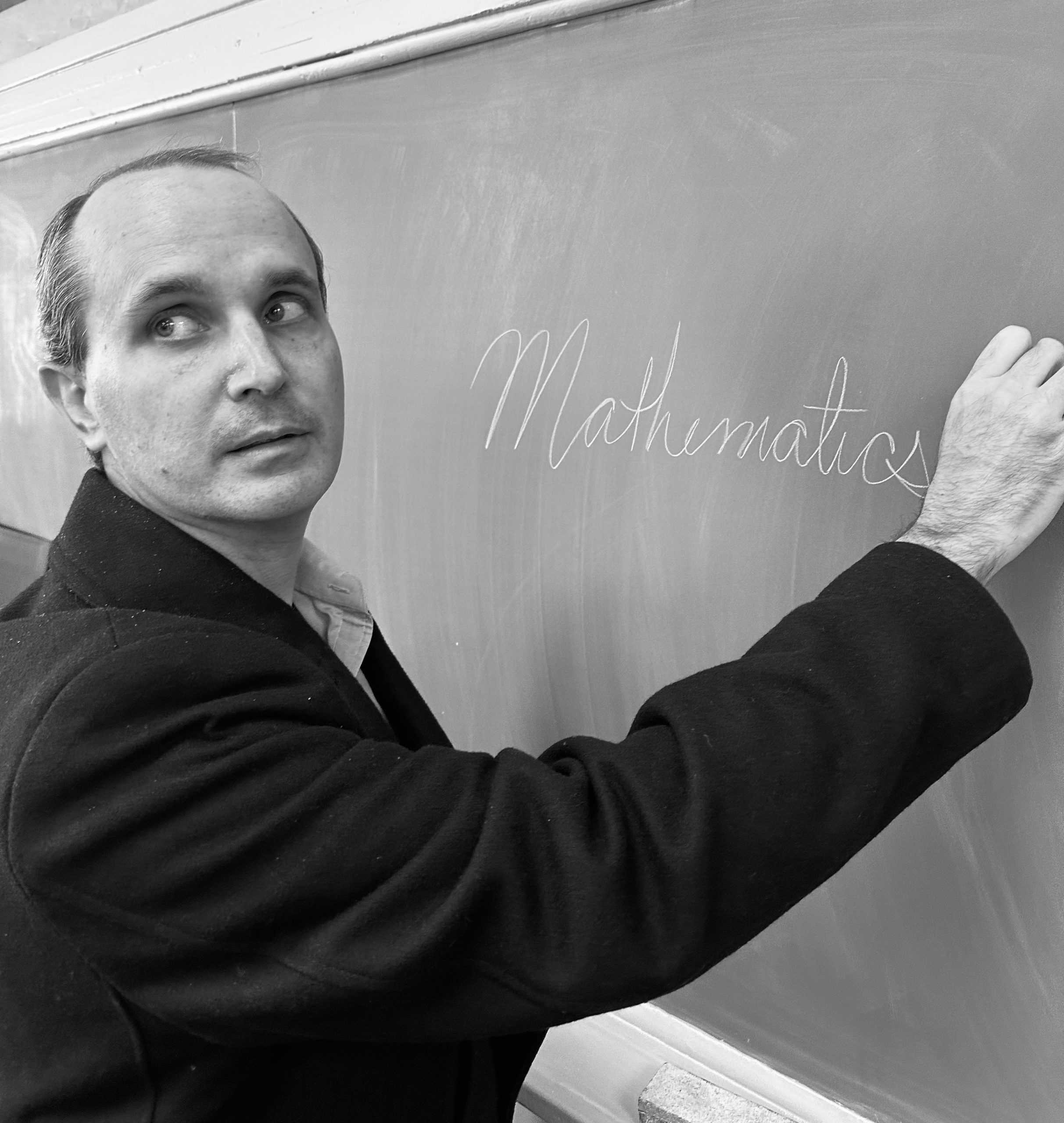 RENAISSANCE MAN: The elegance of Fitzpatrick’s handwriting on the chalkboard is matched only by his mathematical insights. (via the Peabody Press).