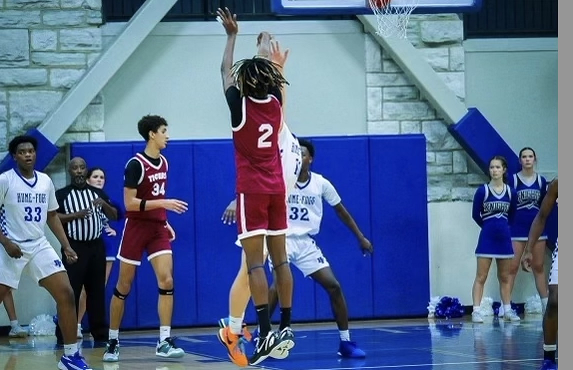 Braylin Davis '24 shooting a three. (via the Peabody Press