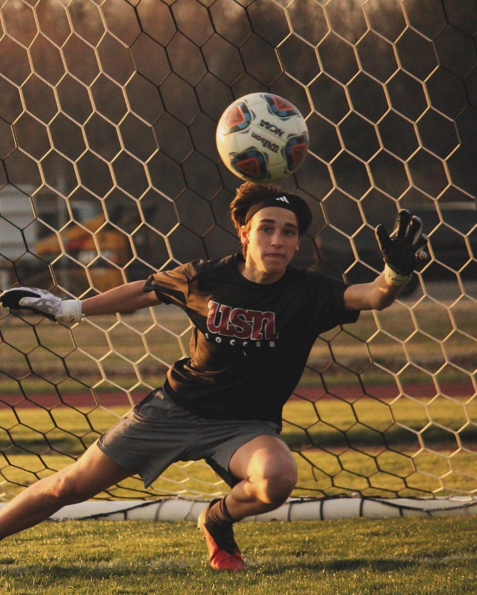Vincent Kehler '26 makes a save in practice on February 22. (via the Peabody Press)