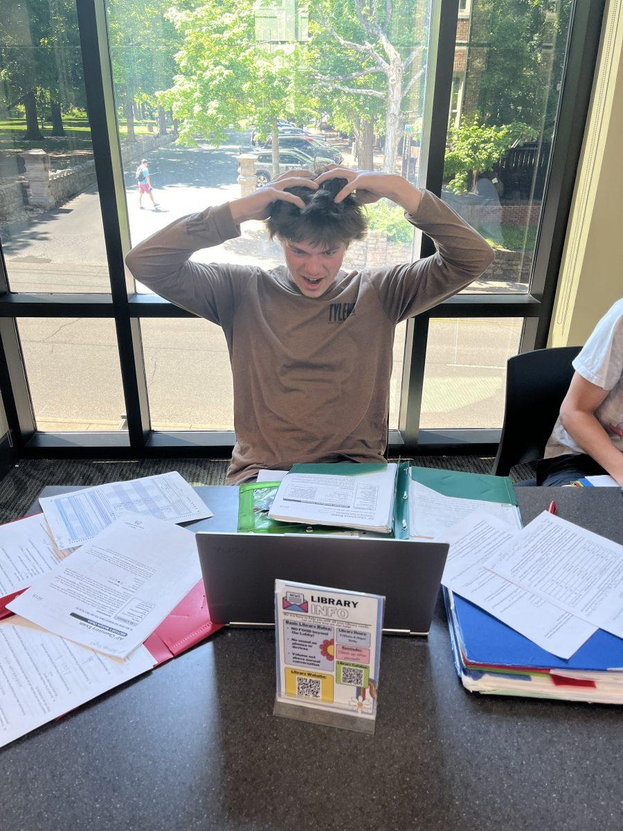 Nathan Vogeli '25 in the library losing his mind over the swarm of work