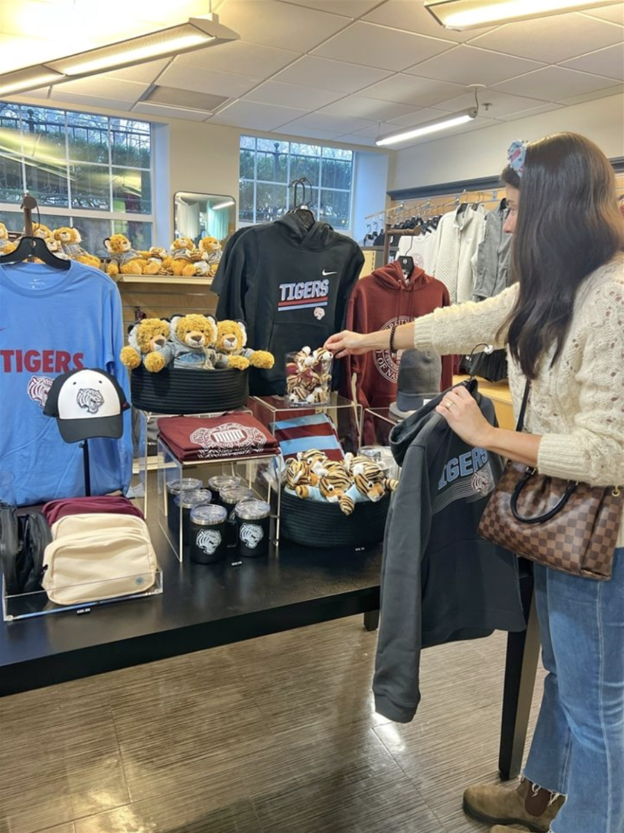 STYLE & COMFORT: A parent shops for USN apparell at the news USN Spirit Store. (via usn.org)