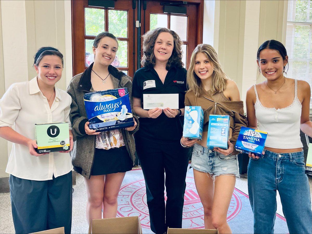 Left to right: Margot Ross '24, Clara Smail '24, Nashville Rescue Mission's Bonnie Broberg, Cléo Gauthier '25, and Kareena Kloek '25 pose after the conclusion of the Fem Club's menstrual product drive (via Nashville Rescue Mission)