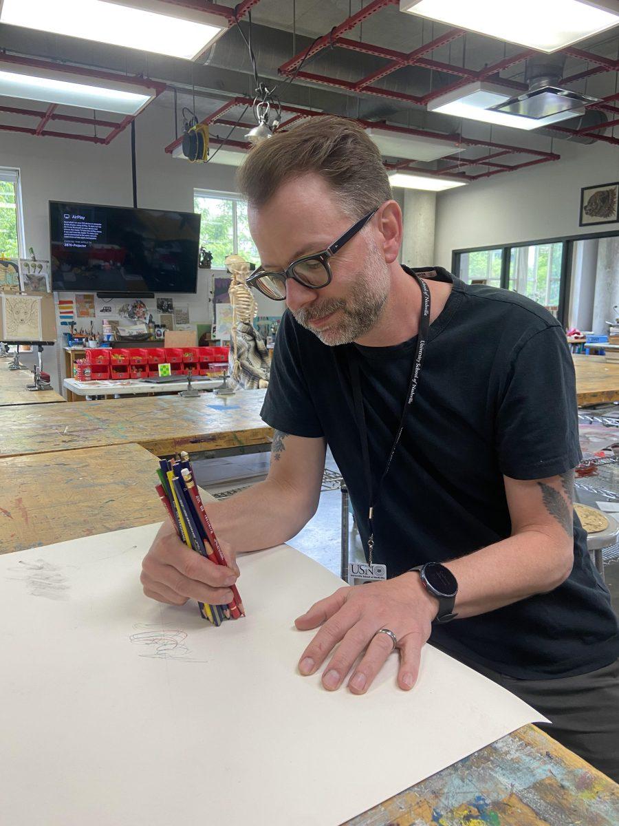 Cheney works on a project in his studio. (via the Peabody Press)