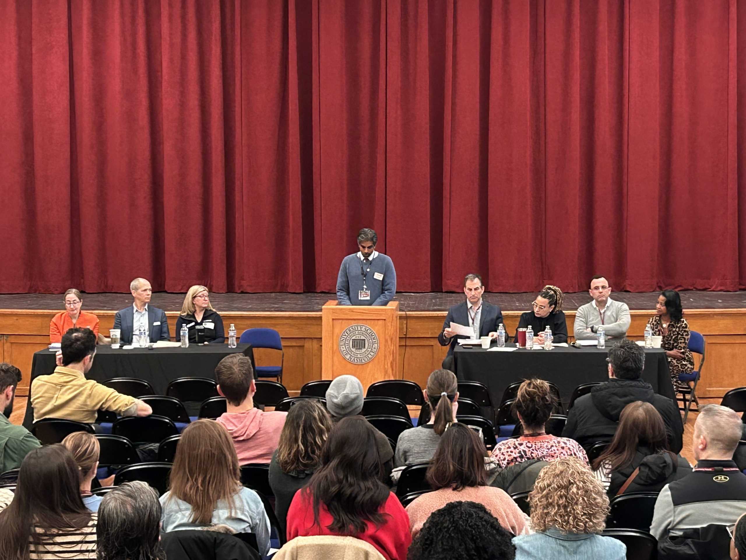 Reddy speaking at a community meeting held by the Ad Hoc Committee.  (via The Peabody Press)