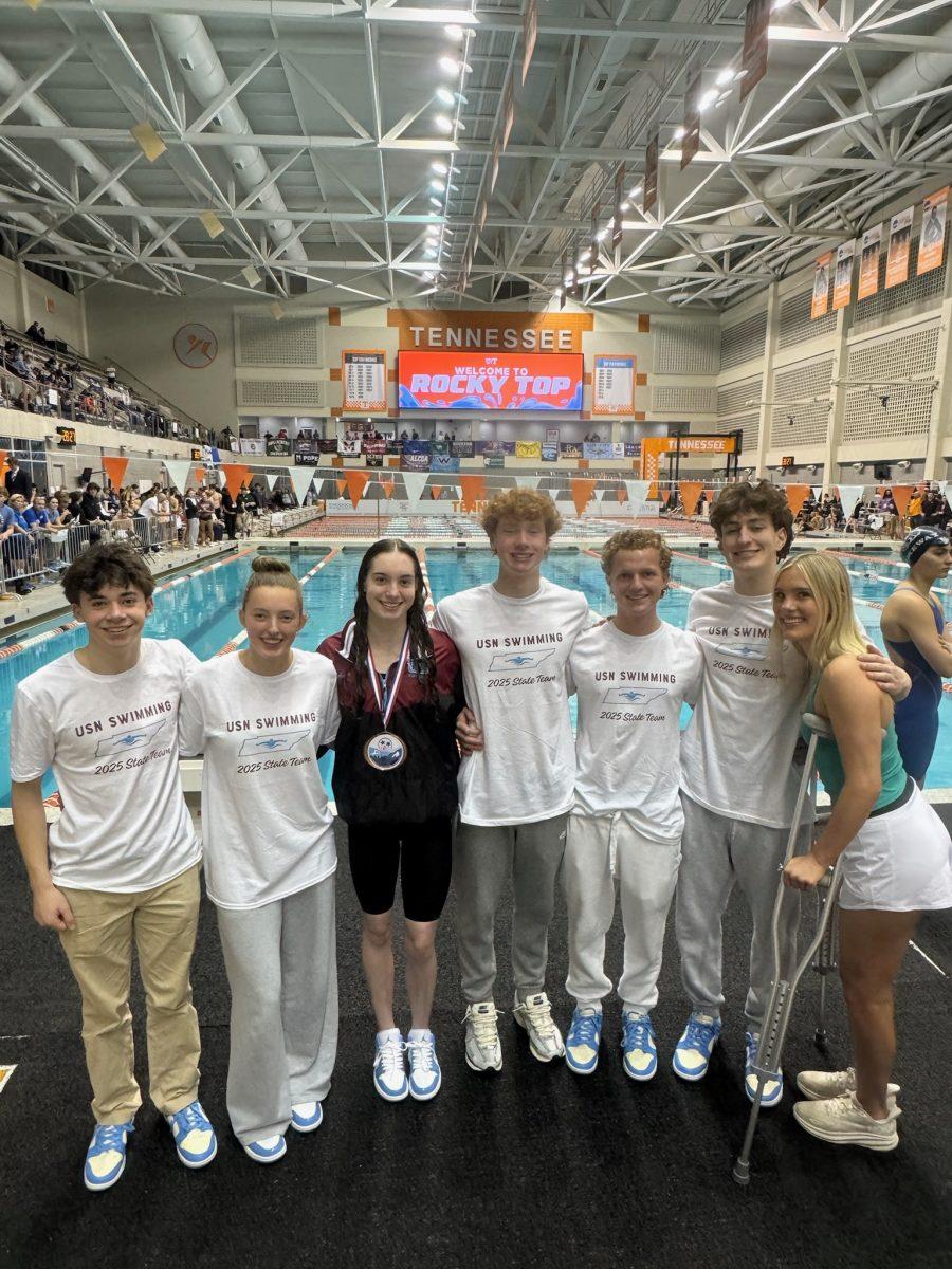 From left to right: Jack Fruin ‘27, Aurelia Sloane ‘27, Anna Hulan ‘25, Leo Frein ‘25, Dean Stevenson ‘26, Sawyer Beckwith ‘25, and Olivia Barbieri ‘25, pose for a picture after a historic state meet. (via Leo Frein)
