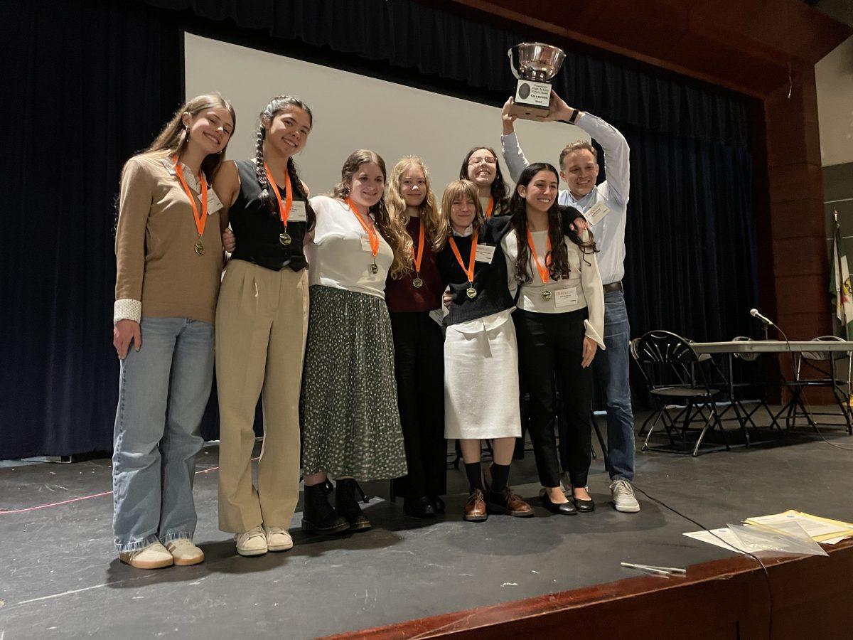 Ethics Bowl’s A team holding the coveted “Ethics Bowl” after winning the regional championship.  (Photo provided)Ethics Bowl’s A team holding the coveted “Ethics Bowl” after winning the regional championship.  (Photo provided)