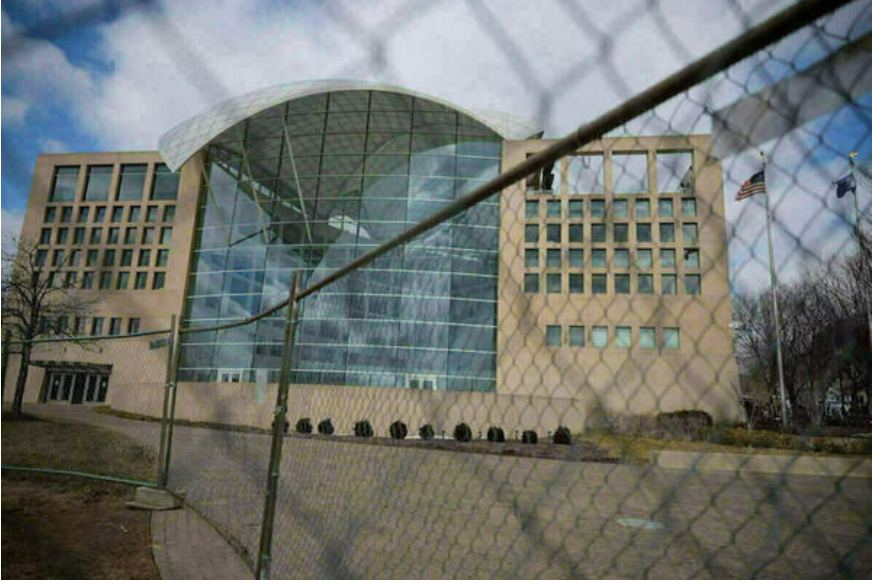 The shuttered USIP looms from behind a high fence (photo via the Keough School of Global Affairs).