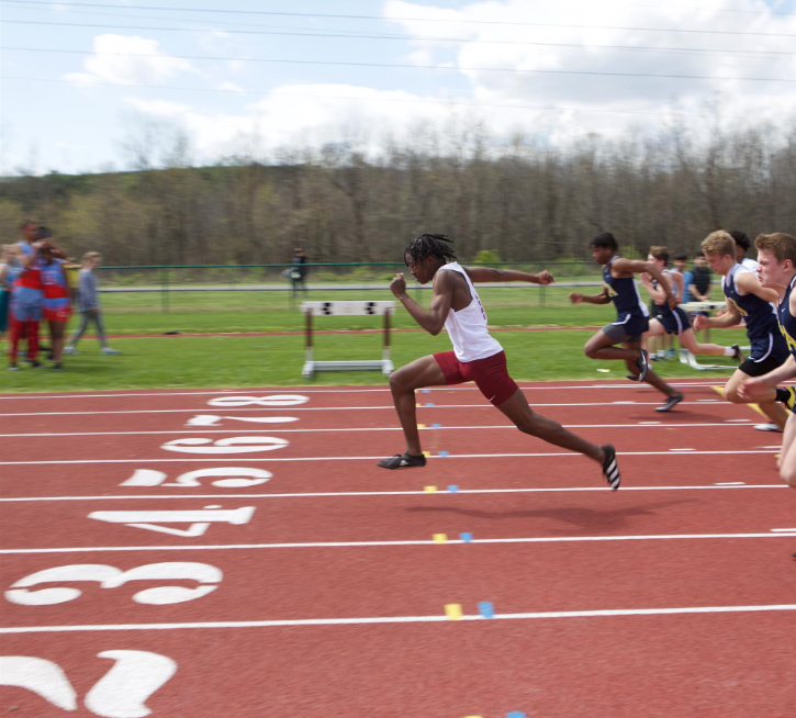 RUNNING TO WIN: Sid Ware '23 races to the finish (Via https://www.usn.org/athletics/usn-tiger-athletics).