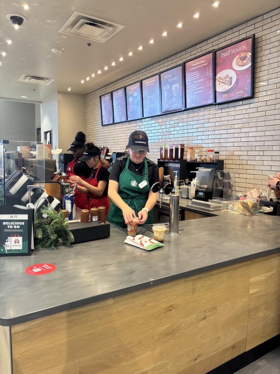 Caroline Stinner ‘27  prepares an order for a customer while moonlighting as a barista.   Employment can help teens develop new competencies and financial literacy skills, as well as build successful time management habits. (photo provided)