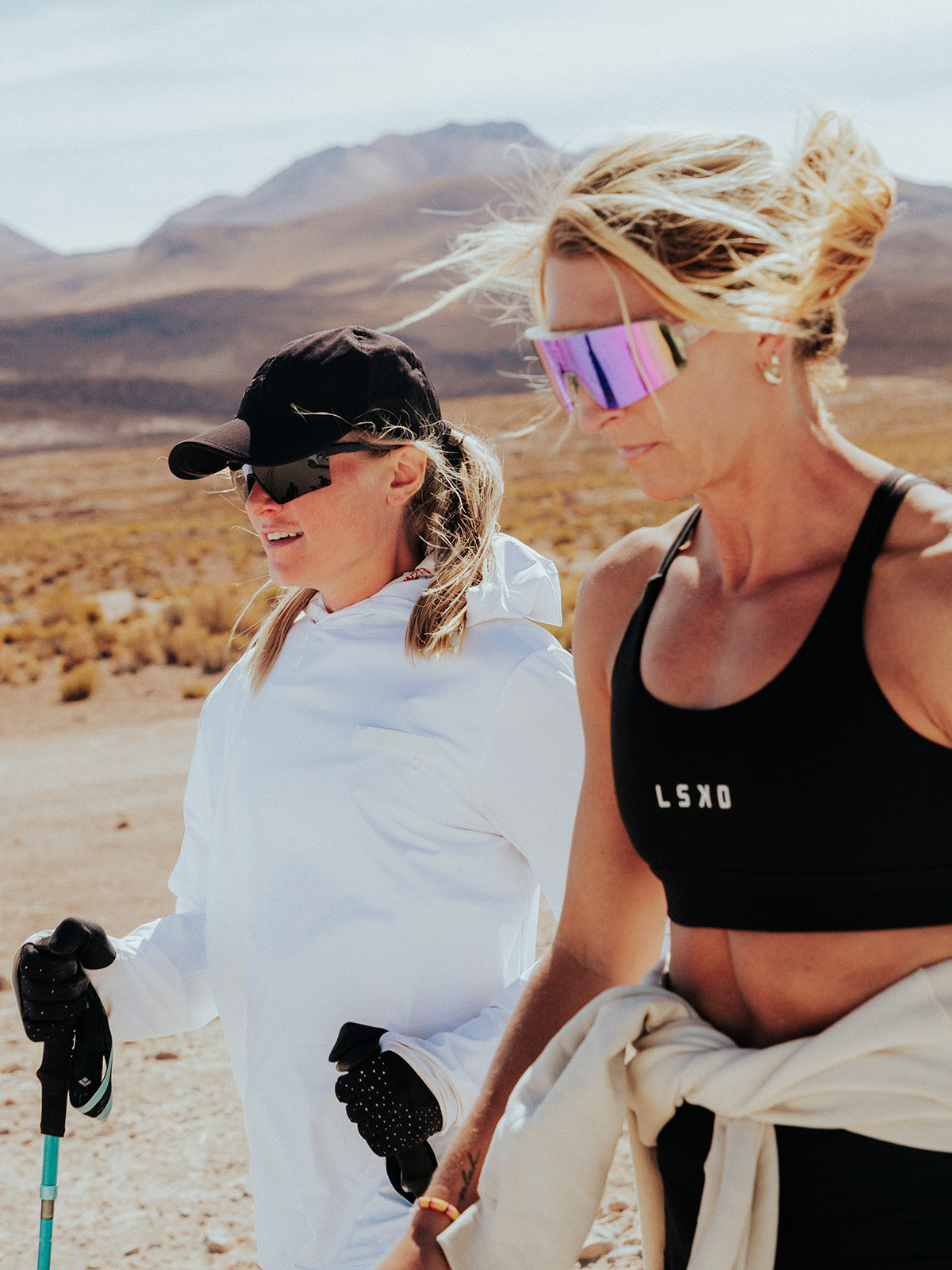 Allie Gibbons and Lindsey Bachman stay focused in the desert mid-race.