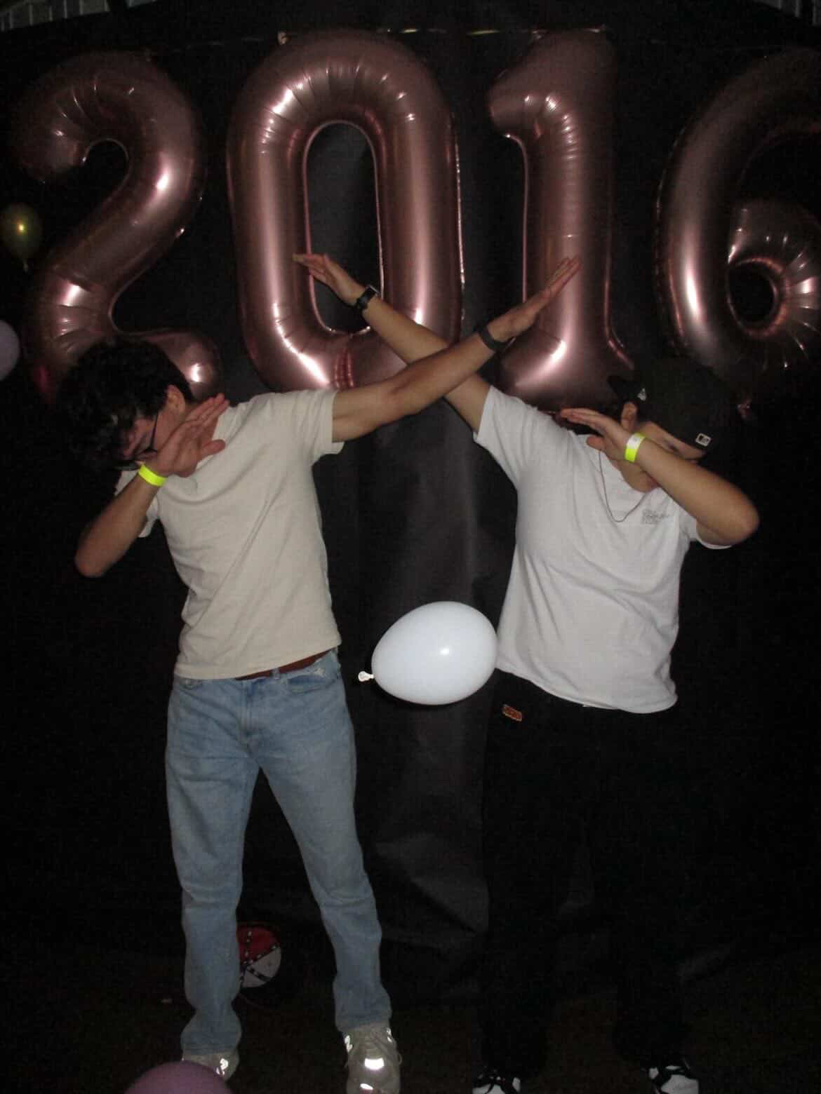 Omeed Irani '26 and Victor Peng '26 dabbing at the dance on February 21. (via the PEAs)