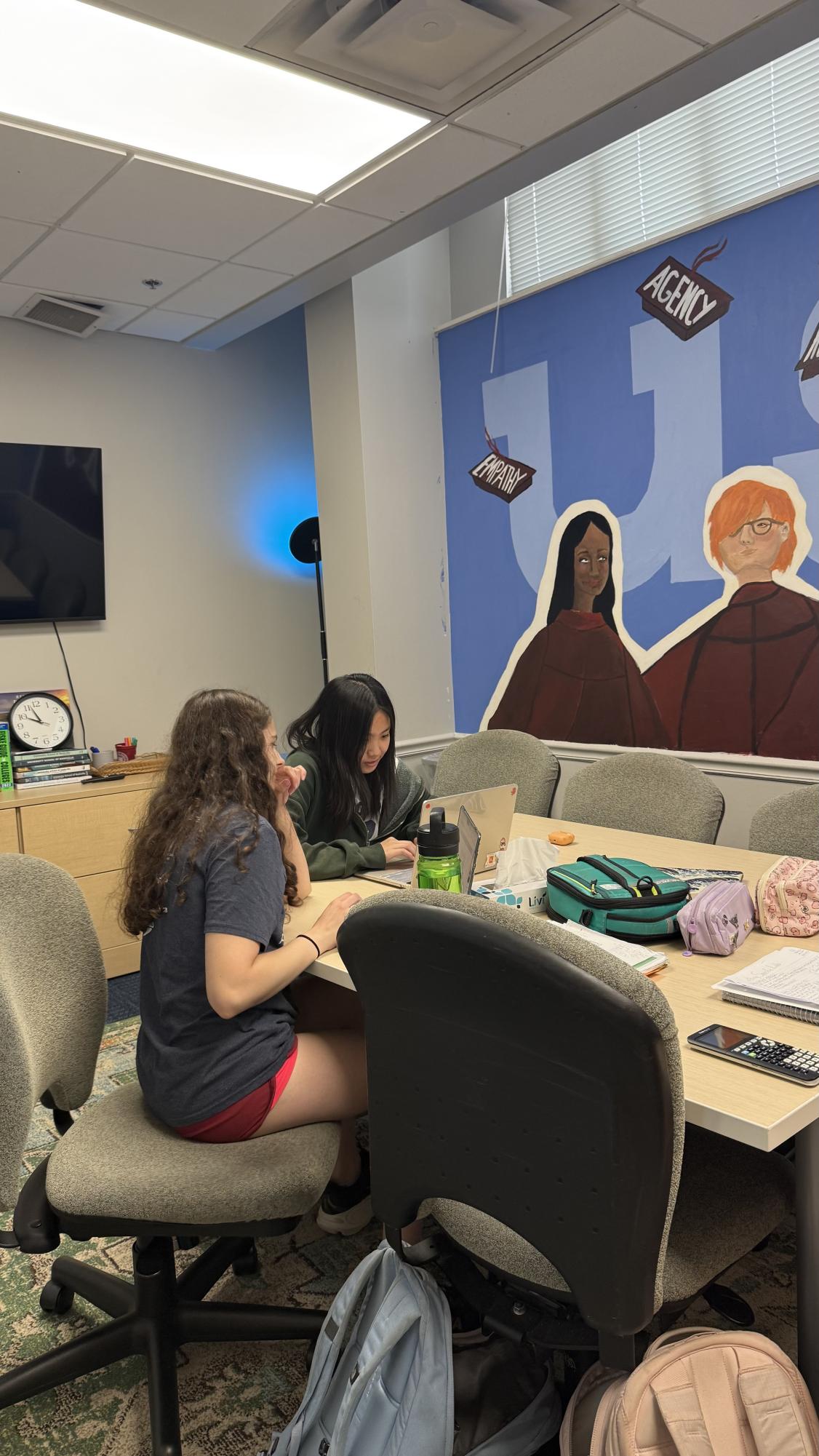 Maggie Weiss and Suzie Zhao study together in the college counseling conference room.