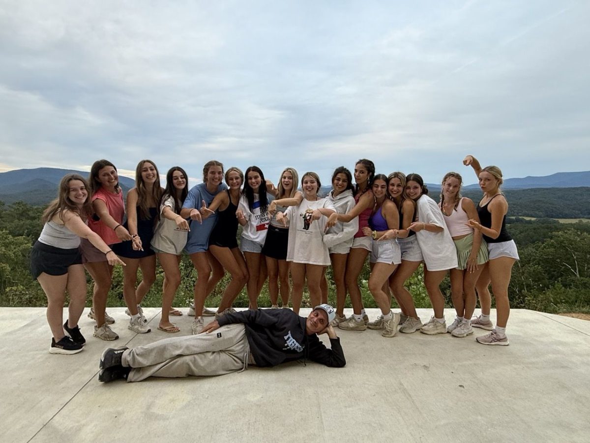 SMILE & POSE: Seniors posing for a picture with Dr. Fitz at retreats (via usn.org)