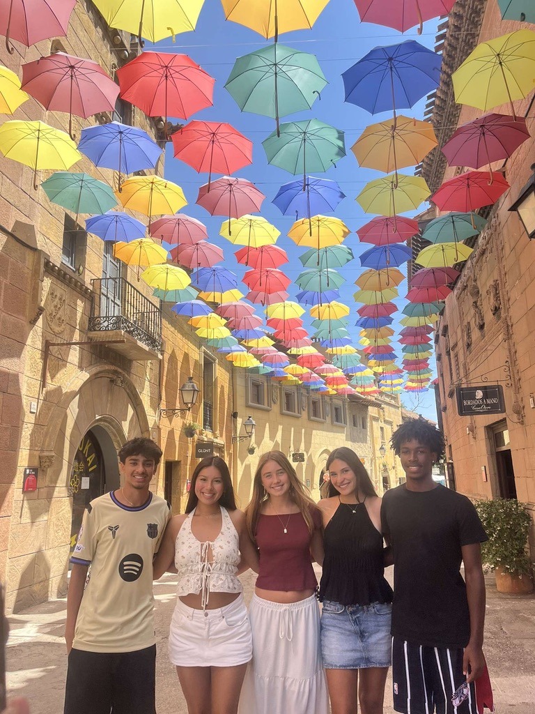 Pastakia (far left) and McMillian (far right) with their cellow CIEE students in an open air market in Barcelona. (photo provided)